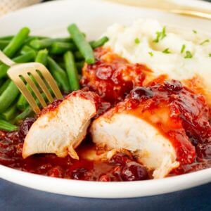 Half Chicken with Cranberry Sauce (served with two sides)