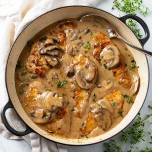 Half Chicken with Mushroom Cream Sauce (served with two sides)